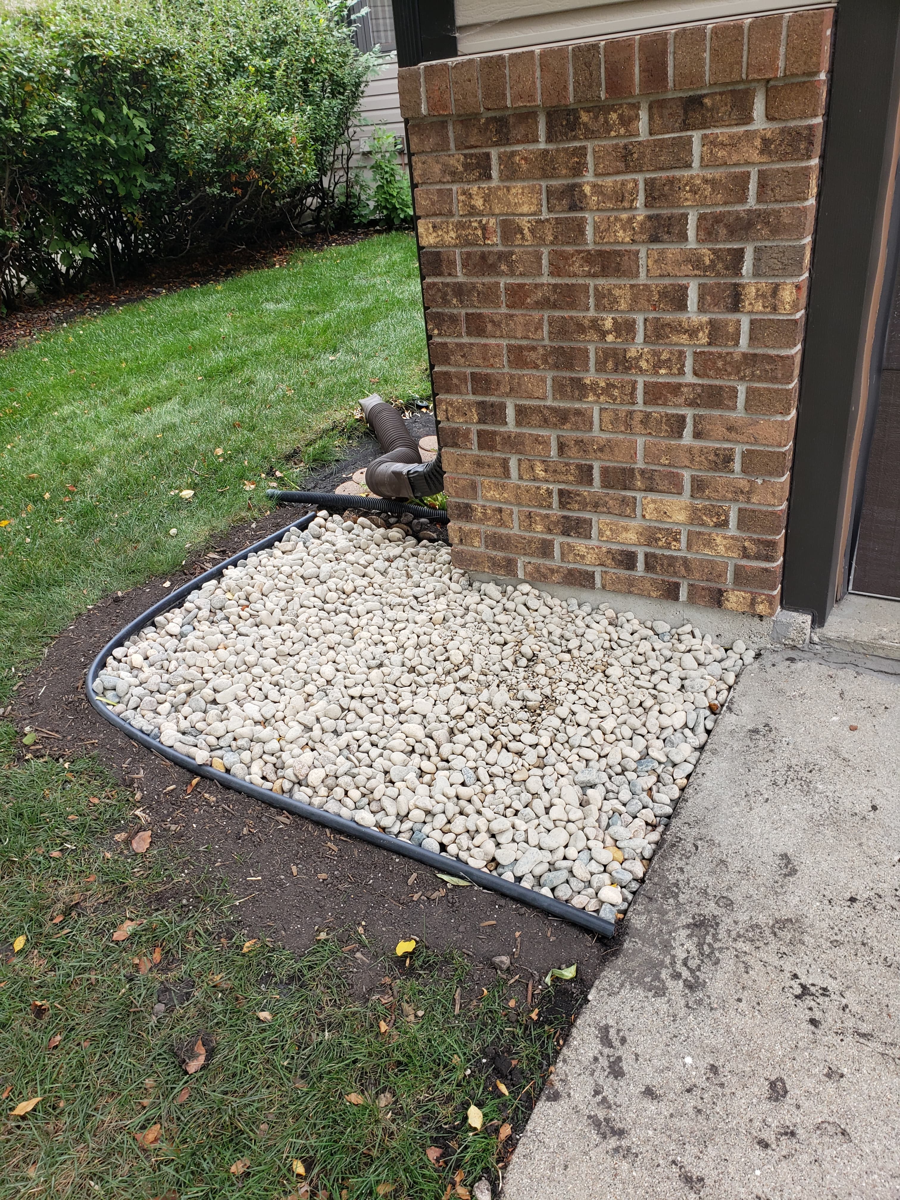 Rock garden bed with clean edging in Fargo ND